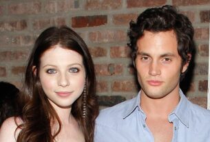 Michelle Trachtenberg and Penn Badgley pose for a photo