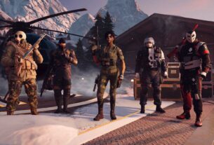 R6 Operators stand in a line up outside of a helicopter.