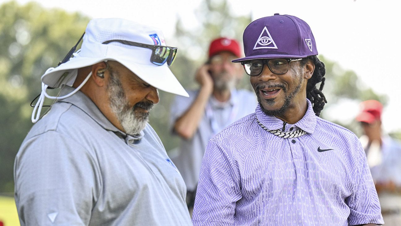 Comedian Micah Katt Williams laughs with PGA TOUR LIVE analyst Michael Collins during the first round of the TOUR Championship, the final event of the FedExCup Playoffs, at East Lake Golf Club on August 29, 2024 in Atlanta, Georgia.