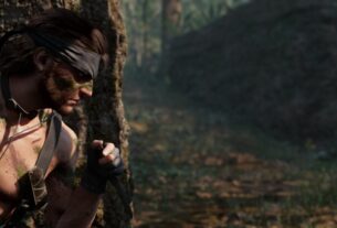 Snake hides behind a tree without wearing a shirt.