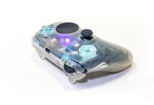 A DIY controller with a touchpad and mousewheel sits on a white backdrop.