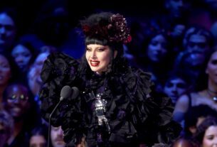 Lady Gaga accepts the artist of the year award onstage during the 2025 MTV Video Music Awards at UBS Arena on Sunday.