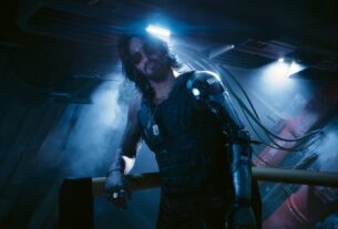Johnny Silverhand leans on a railing.