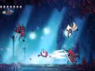 Hornet fights off enemies in a blue level.