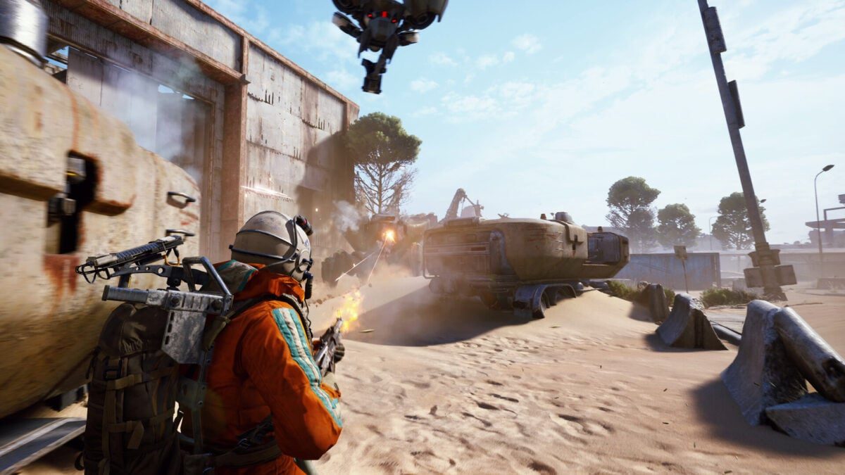 A player character opens fire in the desert.