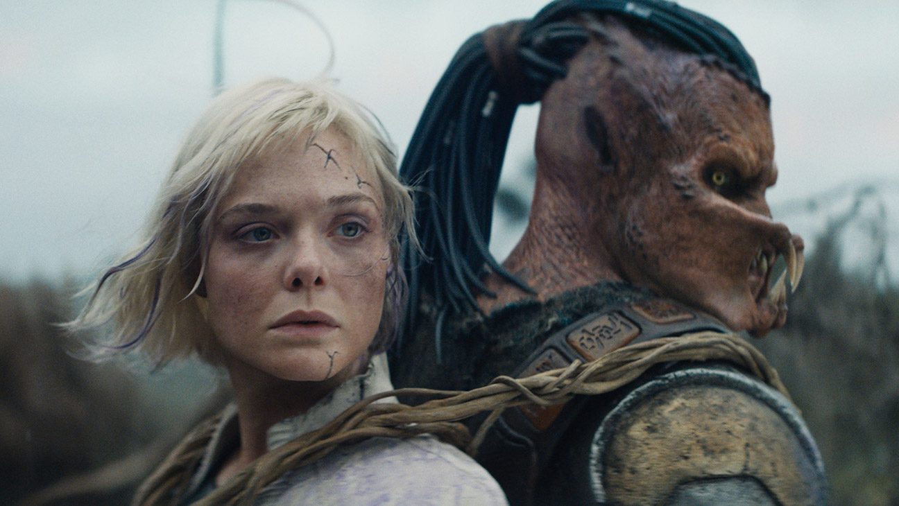 (L-R) Thia (Elle Fanning) and Dek (Dimitrius Schuster-Koloamatangi) in 20th Century Studios' Predator: Badlands